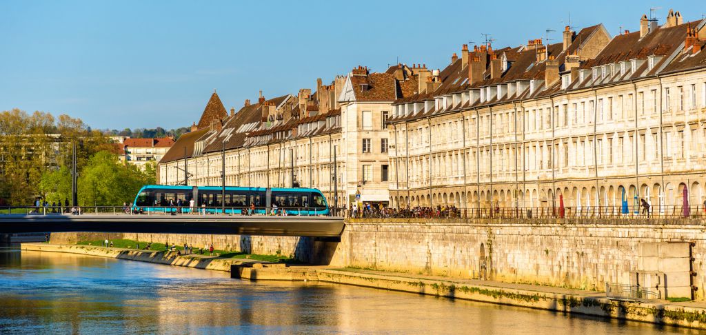 View of embankment in Besancon with tram on a bridge - France